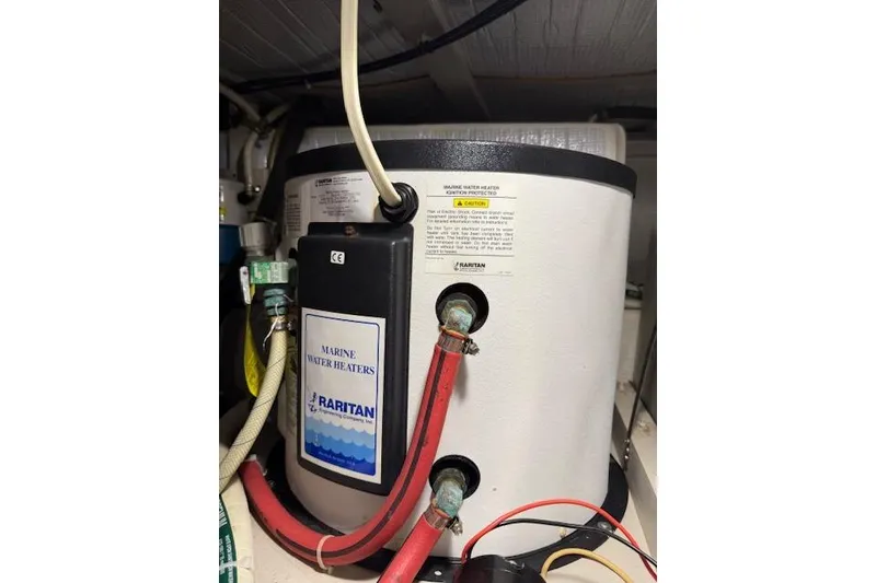 Slide: The Image of Marine water heater in a 2001 Sabreline Sedan boat, featuring Raritan brand components. - 51