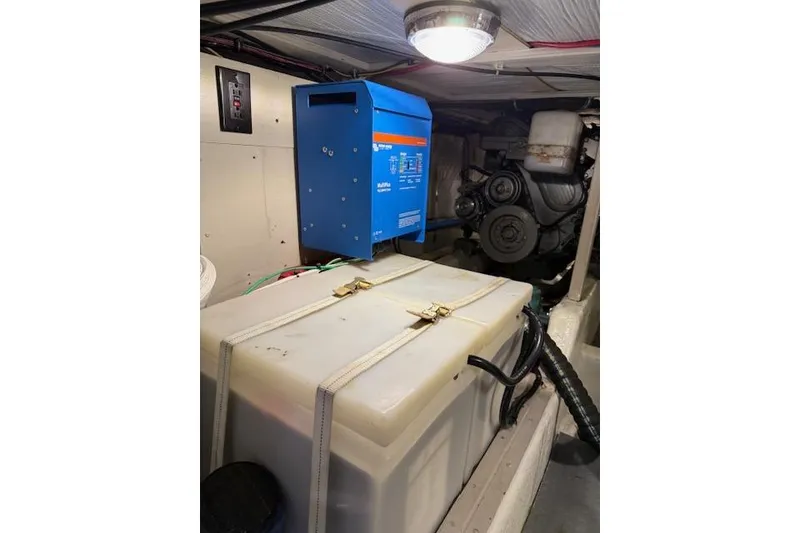 Slide: The Image of Engine room of a 2001 Sabreline Sedan with equipment and storage tank. - 52