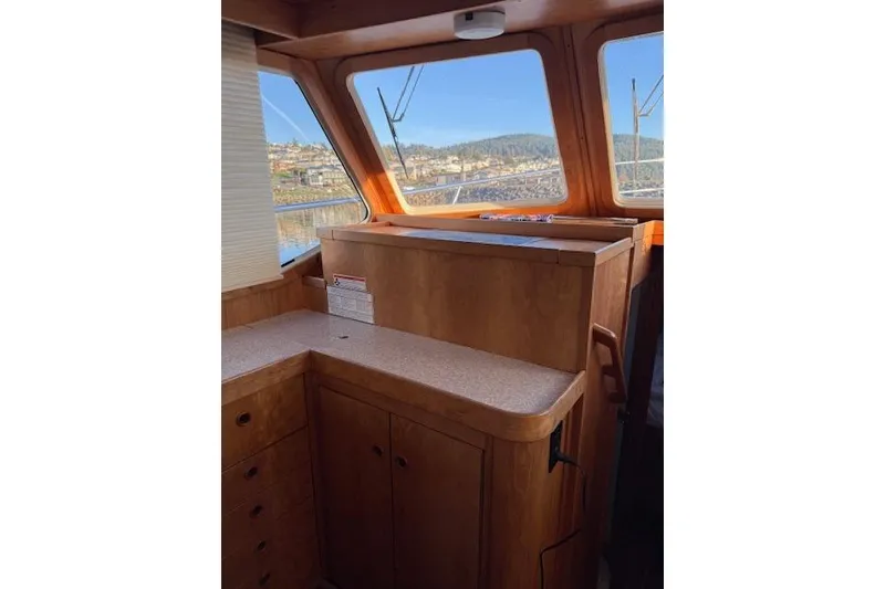 Slide: The Image of Interior of 2001 Sabreline Sedan with wooden cabinetry and large windows. - 22