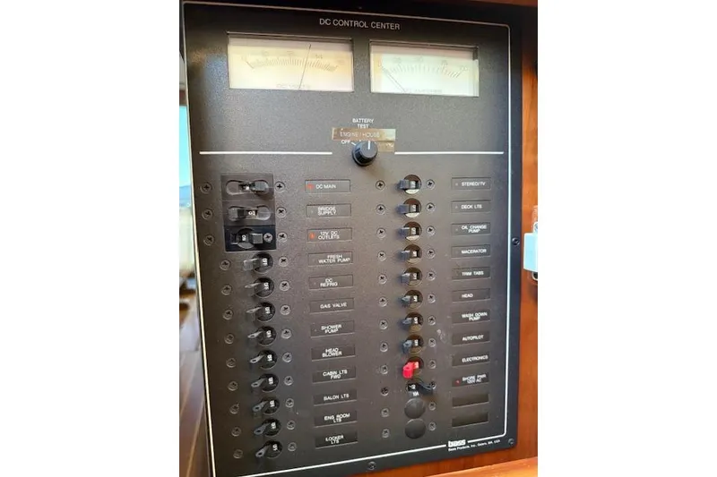 Slide: The Image of 2001 Sabreline Sedan DC control panel with switches and gauges. - 25
