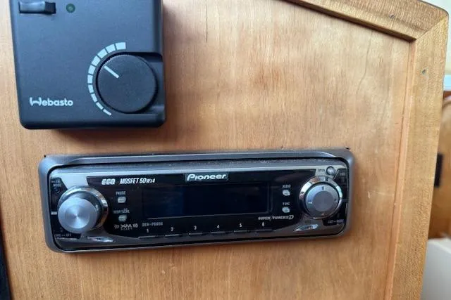 Slide: The Image of 2001 Sabreline Sedan interior with Pioneer stereo and Webasto control panel. - 27