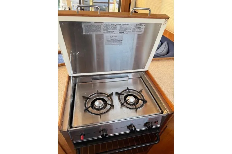 Slide: The Image of Two-burner stove in 2001 Sabreline Sedan boat kitchen. - 32