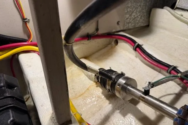 Slide: The Image of Engine room of 2001 Sabreline Sedan with visible wiring and piping. - 53