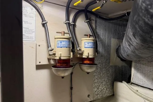 Slide: The Image of Fuel filters in a 2001 Sabreline Sedan engine room, showcasing dual filtration system. - 55