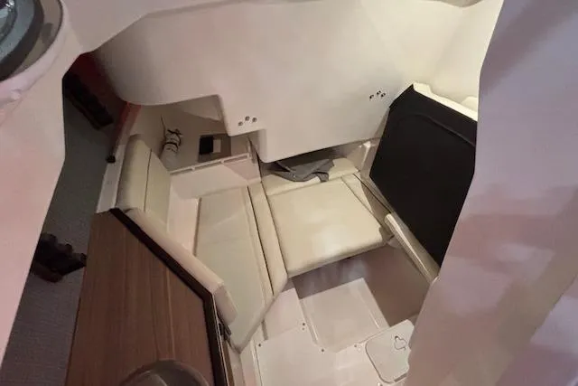 Slide: The Image of Interior cabin of 2026 Solara S-250 CW boat with beige seating and modern design. - 7