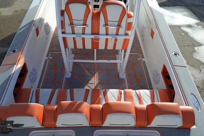 Slide: The Image of 2021 Avanti 36 Center Console boat interior with orange and white seating. - 27