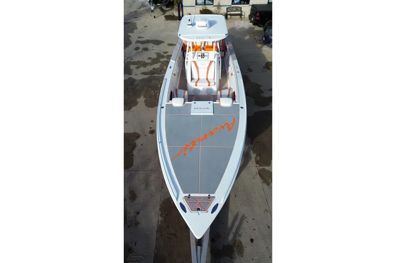 Slide: The Image of 2021 Avanti 36 Center Console boat with sleek design and orange accents. - 33