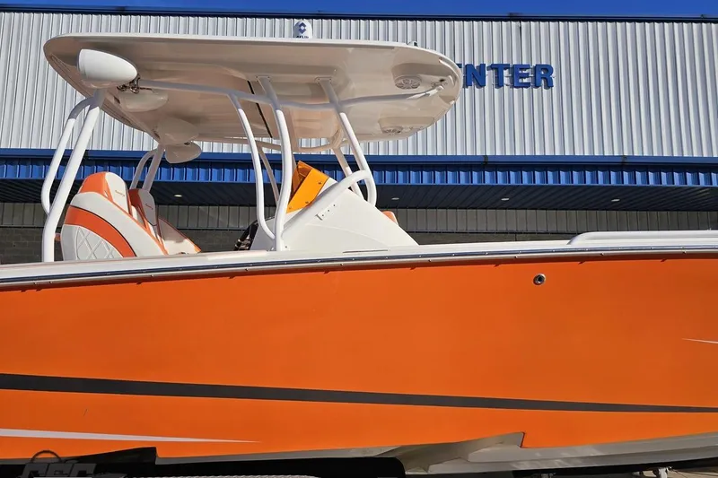 Slide: The Image of 2021 Avanti 36 Center Console boat with vibrant orange hull and sleek design. - 4