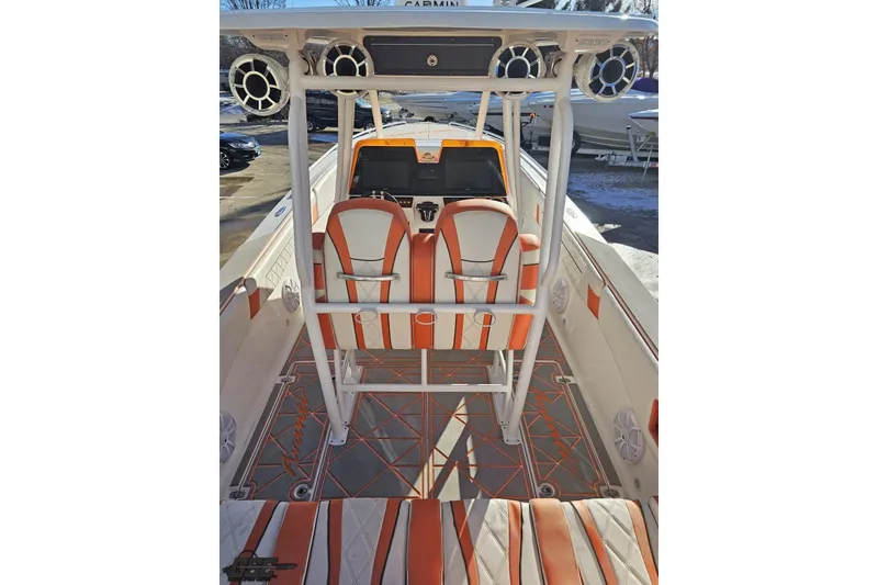 Slide: The Image of 2021 Avanti 36 Center Console boat interior with orange and white seating. - 40