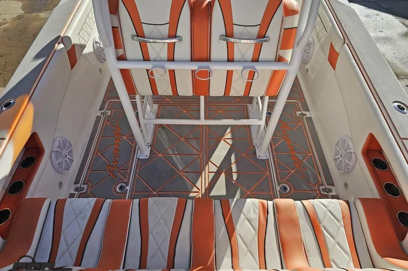 Slide: The Image of 2021 Avanti 36 Center Console boat interior with orange and white seating and custom flooring. - 41