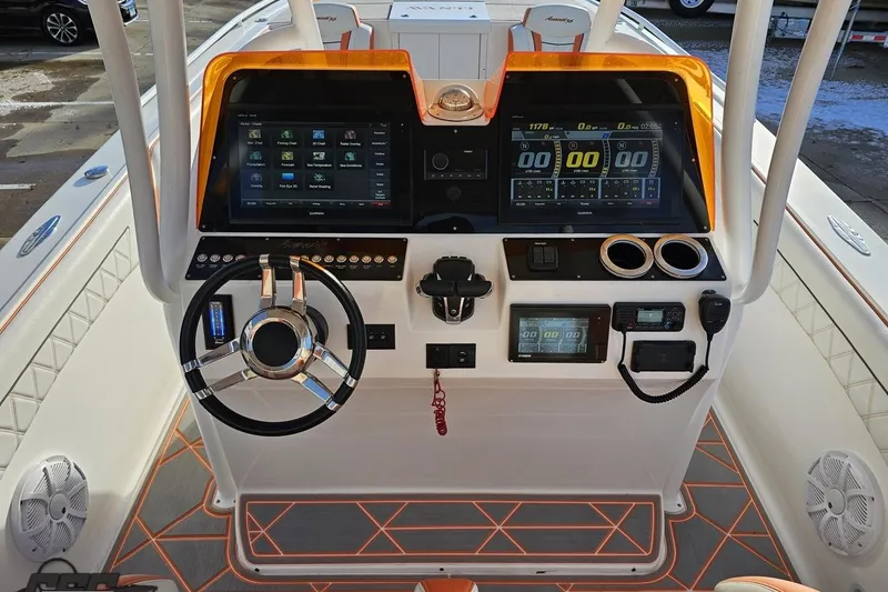 Slide: The Image of 2021 Avanti 36 Center Console boat dashboard with modern navigation and control systems. - 46