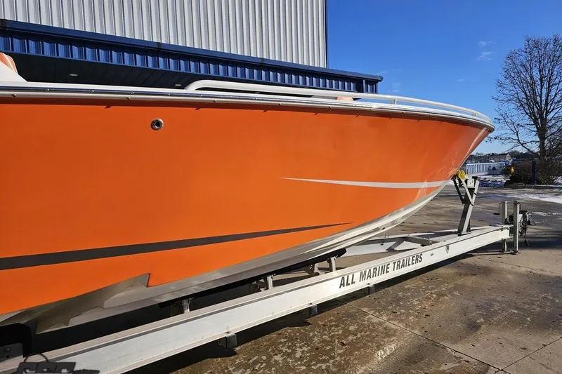 Slide: The Image of 2021 Avanti 36 Center Console boat in vibrant orange on a trailer. - 5