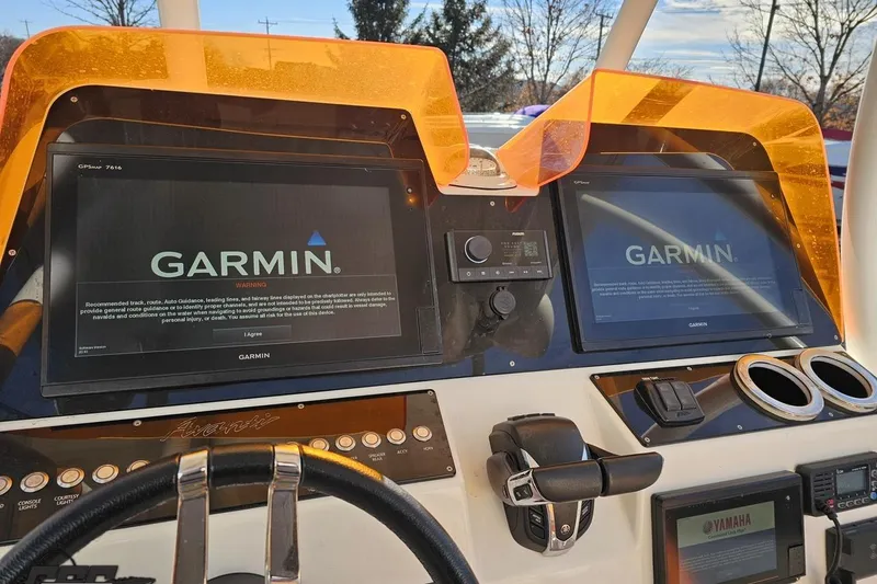 Slide: The Image of 2021 Avanti 36 Center Console dashboard with dual Garmin GPS displays and Yamaha controls. - 50