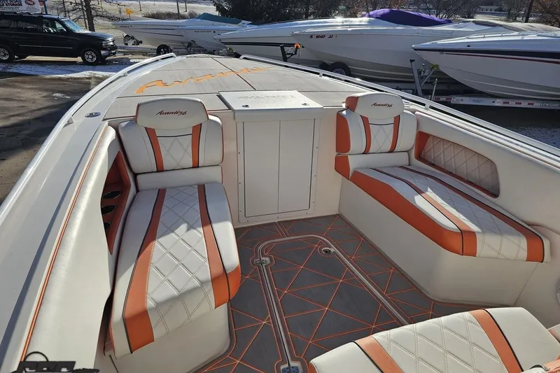 Slide: The Image of 2021 Avanti 36 Center Console boat interior with orange and white seating. - 55
