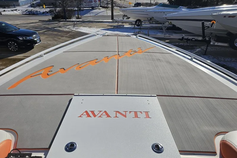Slide: The Image of 2021 Avanti 36 Center Console boat with branded deck in a snowy marina. - 59