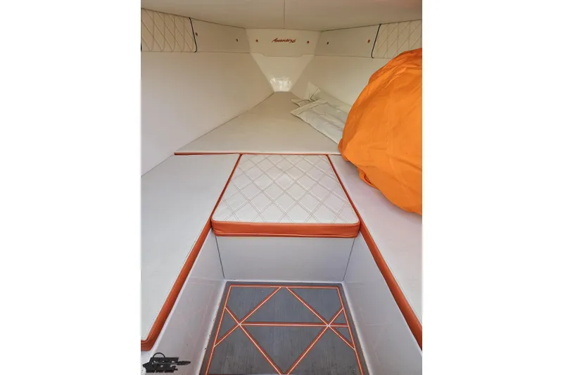 Slide: The Image of 2021 Avanti 36 Center Console cabin interior with orange accents and quilted seating. - 60