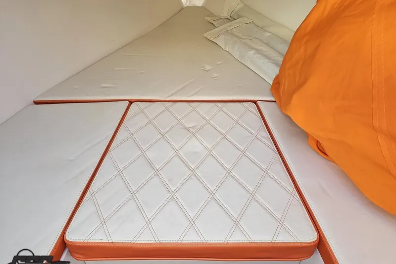 Slide: The Image of Interior cabin of 2021 Avanti 36 Center Console with orange and white cushions. - 62