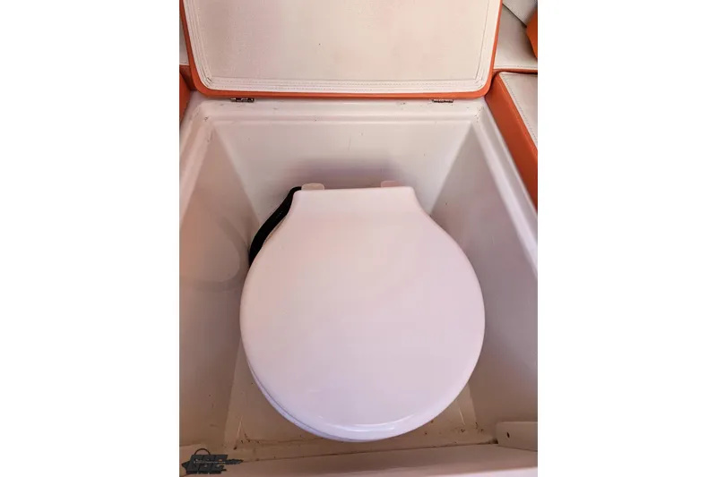 Slide: The Image of 2021 Avanti 36 Center Console boat toilet with closed lid. - 63
