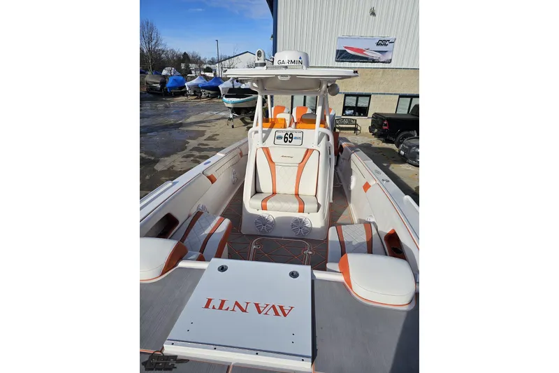 Slide: The Image of 2021 Avanti 36 Center Console boat with orange and white interior, docked outdoors. - 65