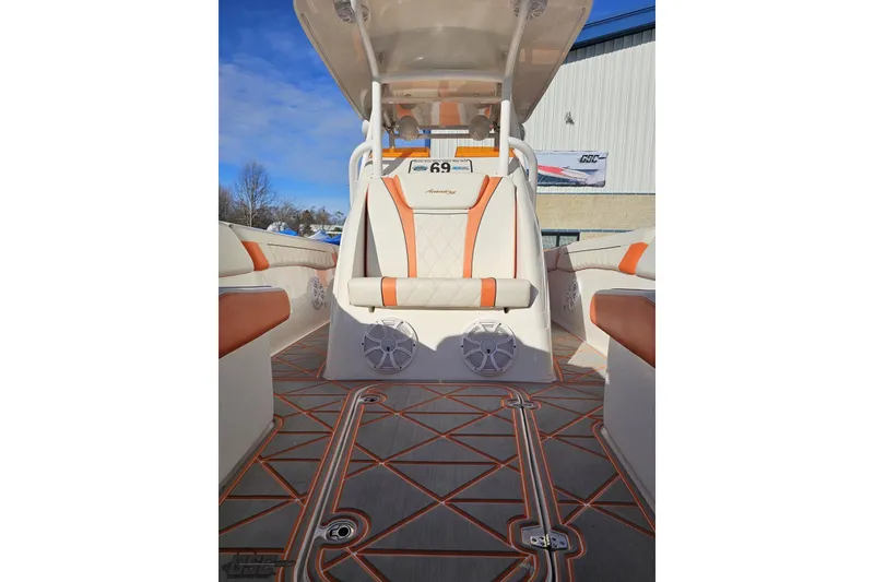 Slide: The Image of 2021 Avanti 36 Center Console boat interior with orange accents and modern design. - 66