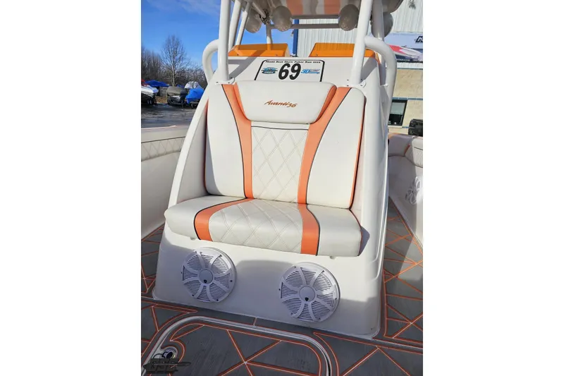 Slide: The Image of 2021 Avanti 36 Center Console boat seat with orange accents and speakers. - 67