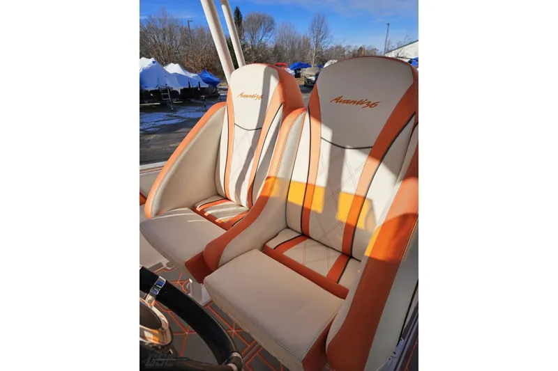 Slide: The Image of 2021 Avanti 36 Center Console boat seats with orange and white upholstery. - 71