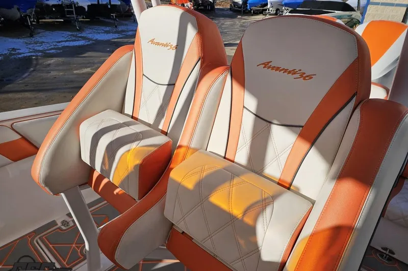 Slide: The Image of Orange and white seats on a 2021 Avanti 36 Center Console boat. - 72