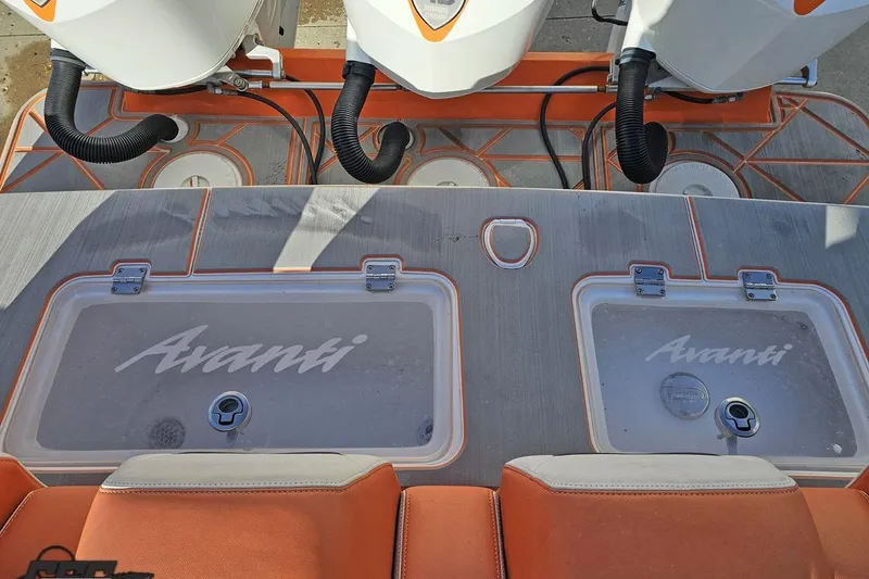Slide: The Image of 2021 Avanti 36 Center Console boat deck with storage compartments and engines. - 75