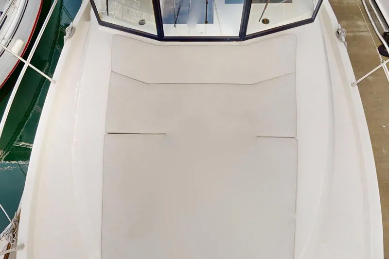 Slide: The Image of 2021 Beneteau Swift Trawler 35 deck with cushioned seating area. - 26