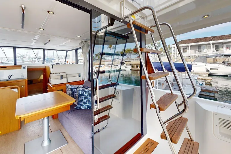 Slide: The Image of Interior of 2021 Beneteau Swift Trawler 35 with modern design and marina view. - 45