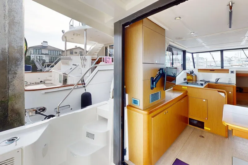 Slide: The Image of Interior view of a 2021 Beneteau Swift Trawler 35, showcasing modern wood cabinetry. - 46