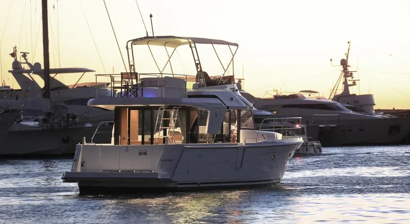Slide: The Image of Beneteau Swift Trawler 35, 2021, docked at sunset. - 6
