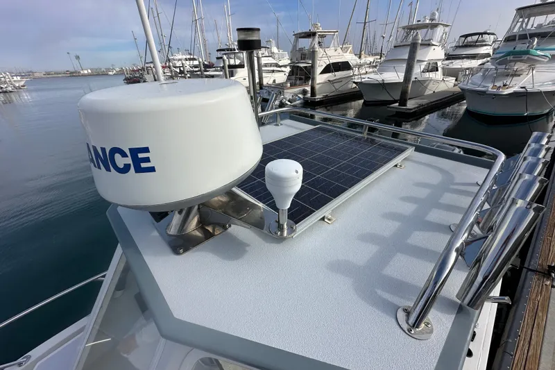 Slide: The Image of 1993 Davis Radoncraft boat with radar and solar panel at marina. - 20