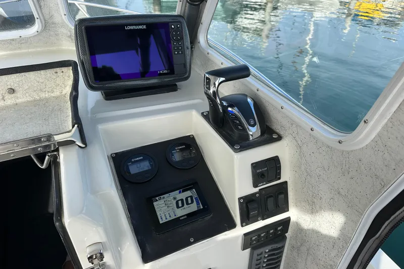 Slide: The Image of 1993 Davis Radoncraft boat dashboard with navigation and control systems. - 22