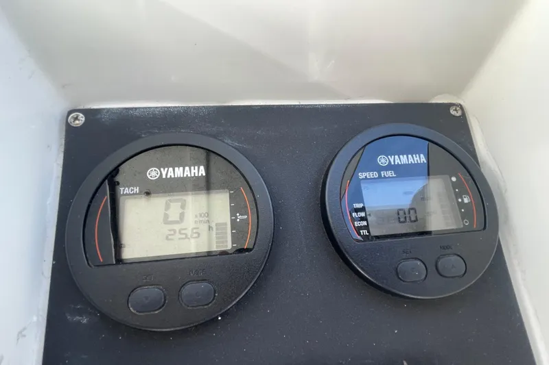 Slide: The Image of Yamaha tachometer and speed fuel gauges on 1993 Davis Radoncraft boat dashboard. - 26