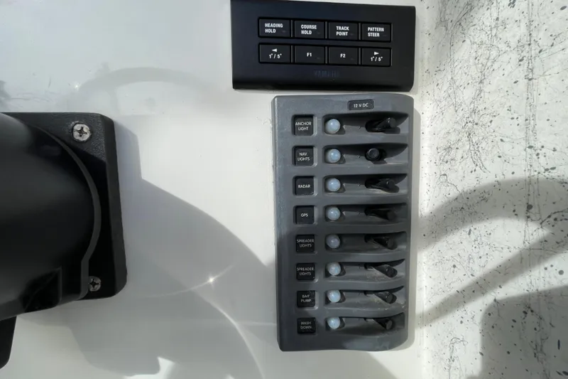 Slide: The Image of Control panel of a 1993 Davis Radoncraft boat with various switches and buttons. - 28