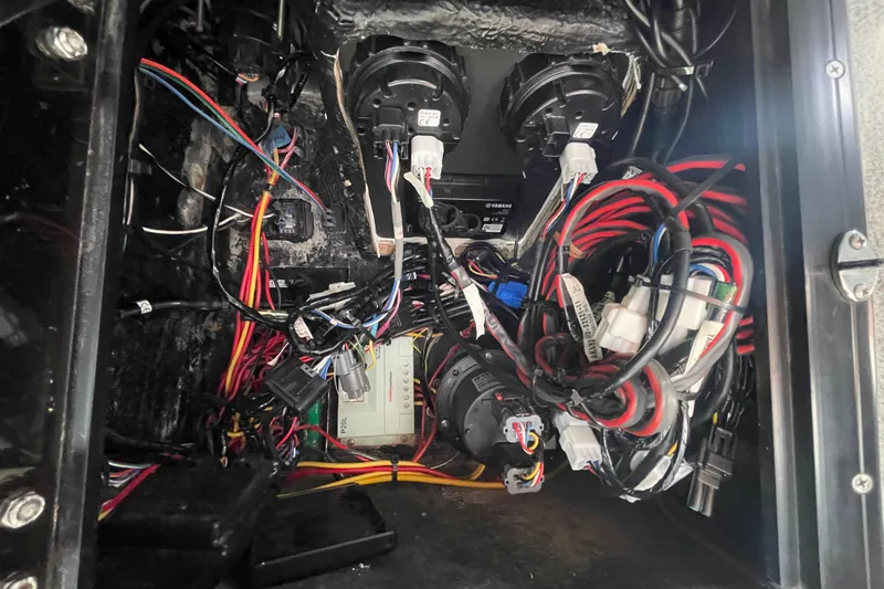 Slide: The Image of Wiring and components inside a 1993 Davis Radoncraft boat, showcasing complex electrical setup. - 29
