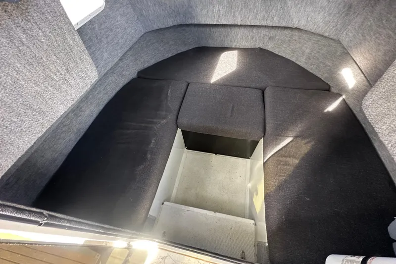 Slide: The Image of Interior cabin of a 1993 Davis Radoncraft boat with cushioned seating. - 31