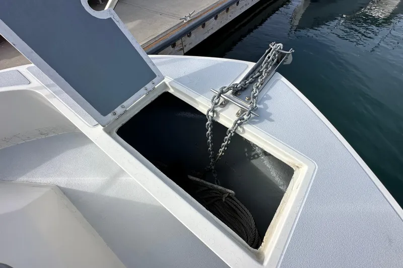Slide: The Image of Open anchor compartment on 1993 Davis Radoncraft boat at dockside. - 36
