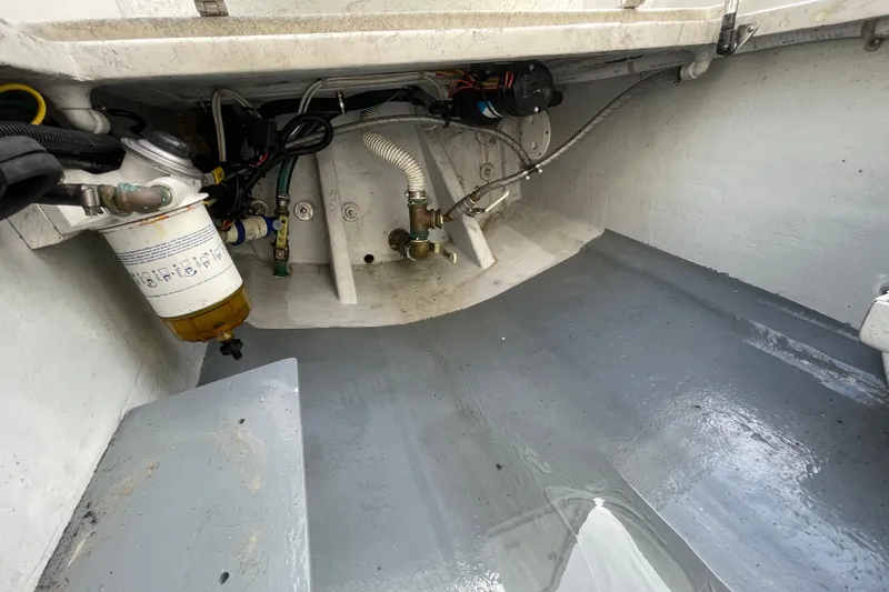 Slide: The Image of Engine compartment of a 1993 Davis Radoncraft boat, showing fuel filter and wiring. - 45