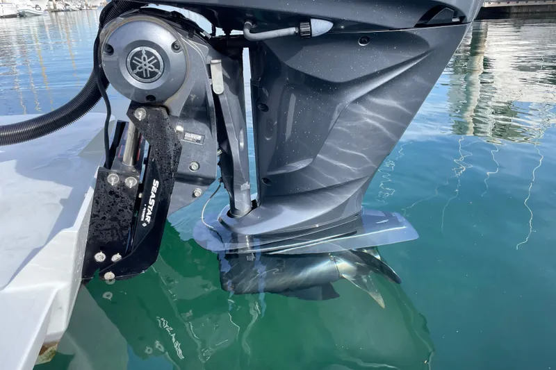 Slide: The Image of Close-up of a 1993 Davis Radoncraft boat motor in clear water. - 47