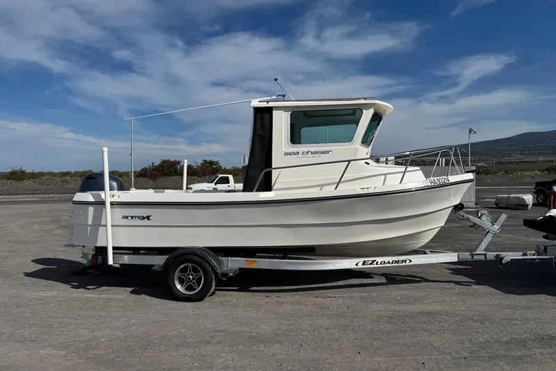 Slide: The Image of 2024 Arima Sea Chaser 19 Yellowtail Edition boat on trailer under clear sky. - 12