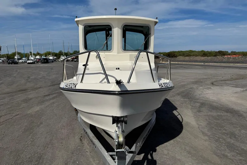Slide: The Image of 2024 Arima Sea Chaser 19 Yellowtail Edition boat on trailer, front view. - 14