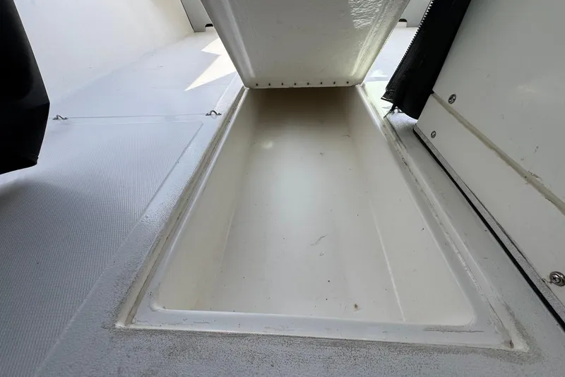 Slide: The Image of 2024 Arima Sea Chaser 19 Yellowtail Edition boat storage compartment interior. - 19