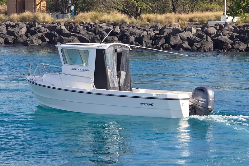 Slide: The Image of 2024 Arima Sea Chaser 19 Yellowtail Edition boat on clear blue water. - 3