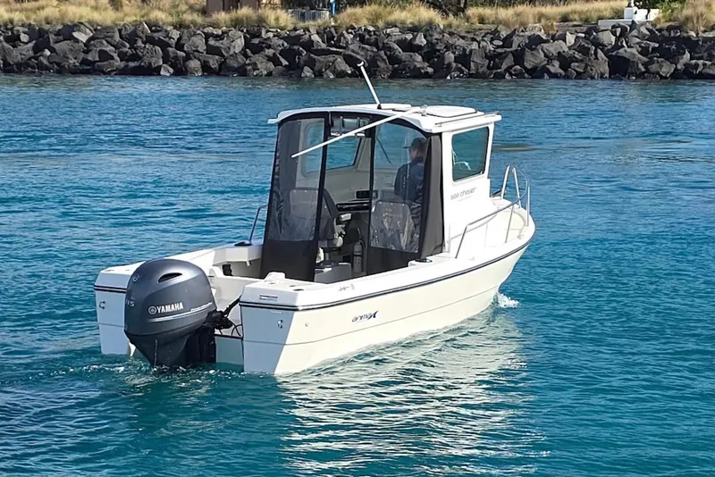 Slide: The Image of 2024 Arima Sea Chaser 19 Yellowtail Edition boat on clear blue water. - 4