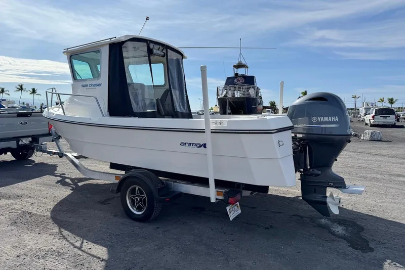 Slide: The Image of 2024 Arima Sea Chaser 19 Yellowtail Edition boat with Yamaha outboard motor on trailer. - 9