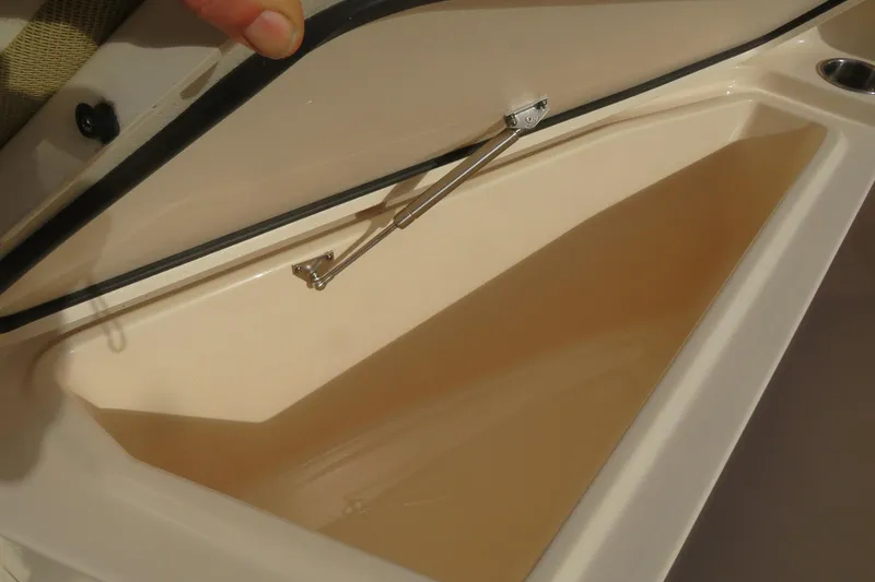 Slide: The Image of 2016 Grady-White Fisherman 209 boat interior with cushioned seating and stainless steel rails. - 13