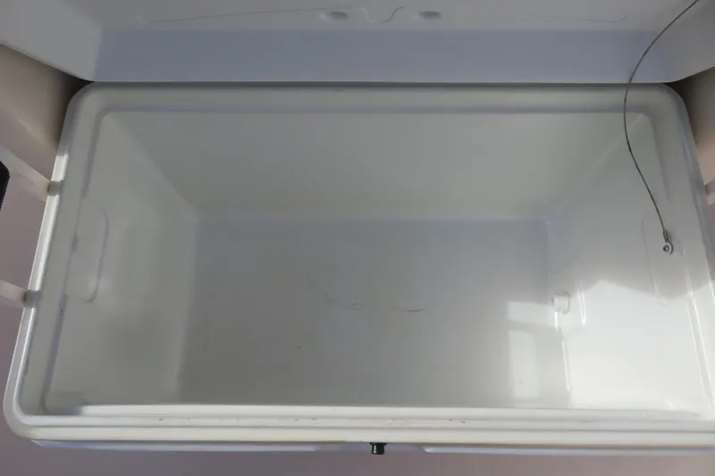 Slide: The Image of Open storage compartment on 2016 Grady-White Fisherman 209 boat. - 17