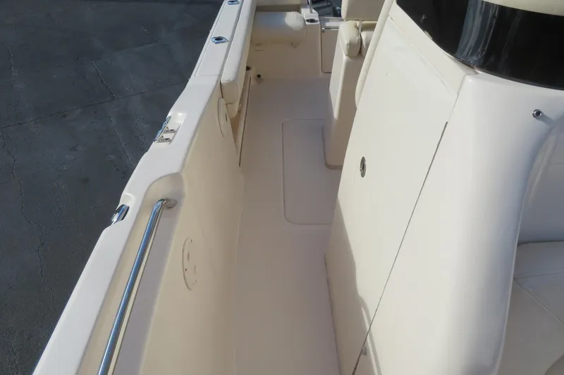 Slide: The Image of 2016 Grady-White Fisherman 209 boat seat with integrated cooler, beige upholstery. - 18